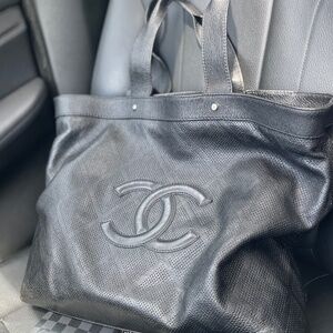 Authentic CHANEL Goatskin Perforated Large CC Tote in Black.
